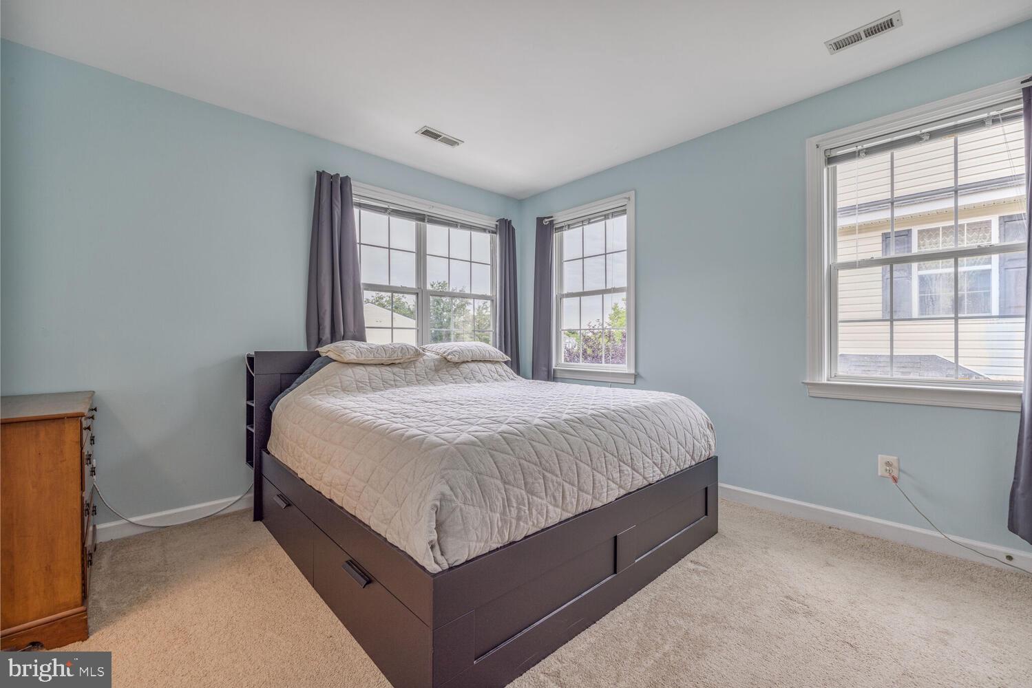 3334 Castle Ridge Circle, Unit 8 Silver Spring, MD 20904 - Photo 13 of 32 a spacious bedroom with a bed and window