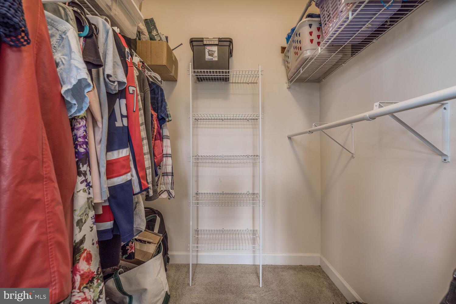 3334 Castle Ridge Circle, Unit 8 Silver Spring, MD 20904 - Photo 14 of 32 a view of walk in closet with clothes