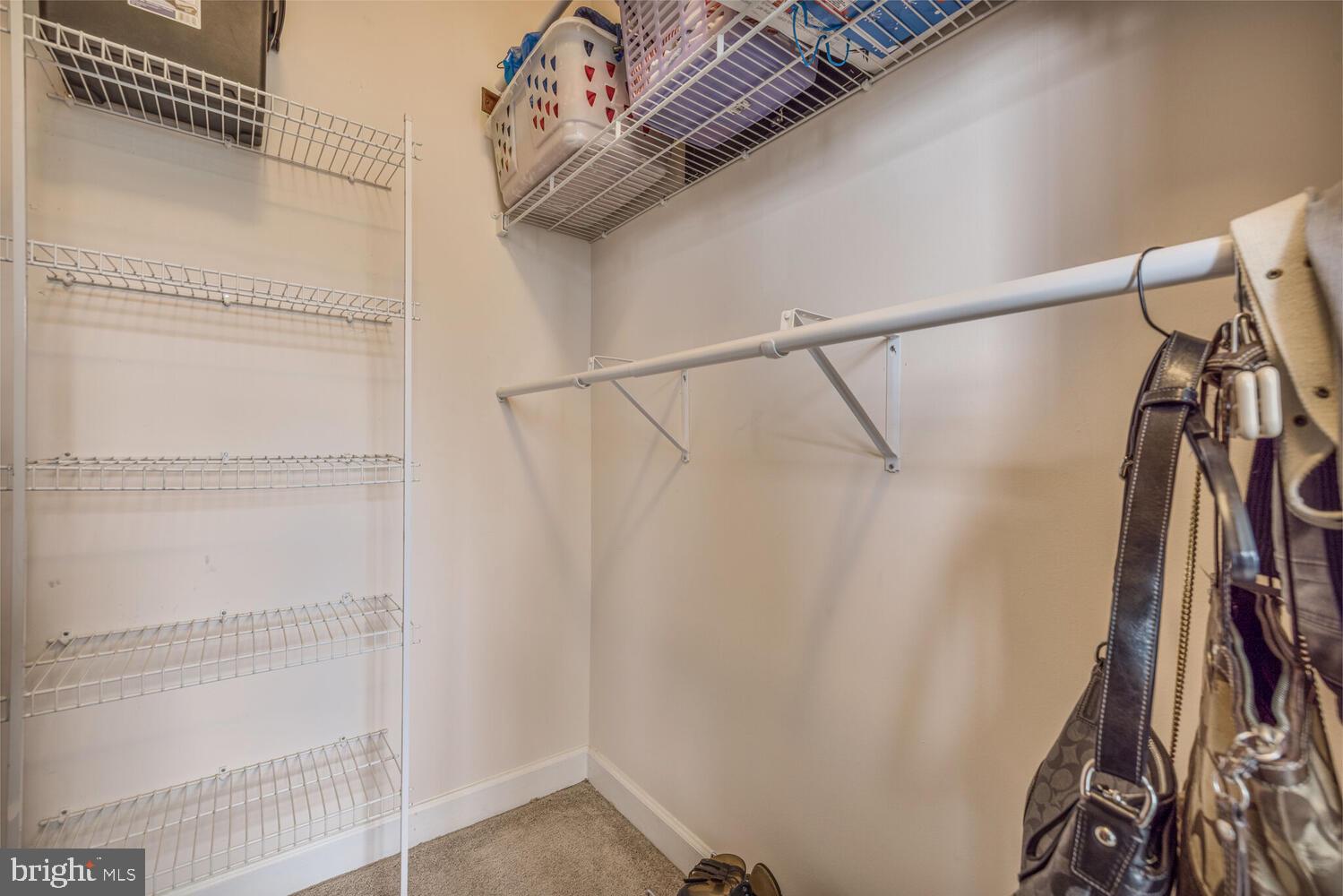 3334 Castle Ridge Circle, Unit 8 Silver Spring, MD 20904 - Photo 15 of 32 a view of walk in closet with clothes