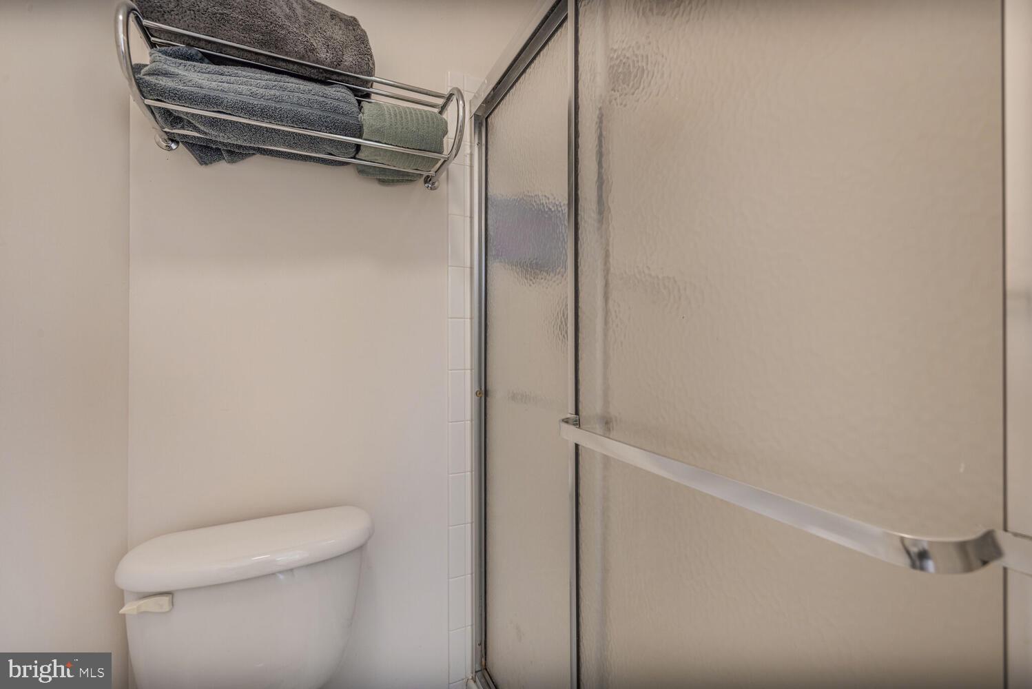 3334 Castle Ridge Circle, Unit 8 Silver Spring, MD 20904 - Photo 18 of 32 a bathroom with a shower and toilet