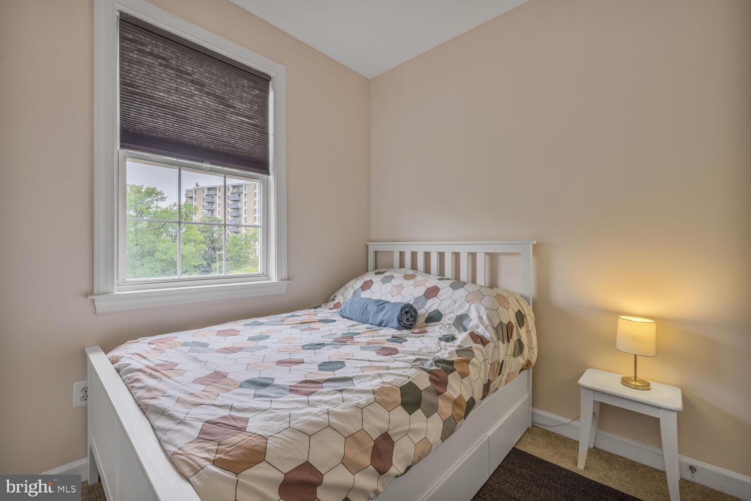 3334 Castle Ridge Circle, Unit 8 Silver Spring, MD 20904 - Photo 19 of 32 a bedroom with a bed and a window