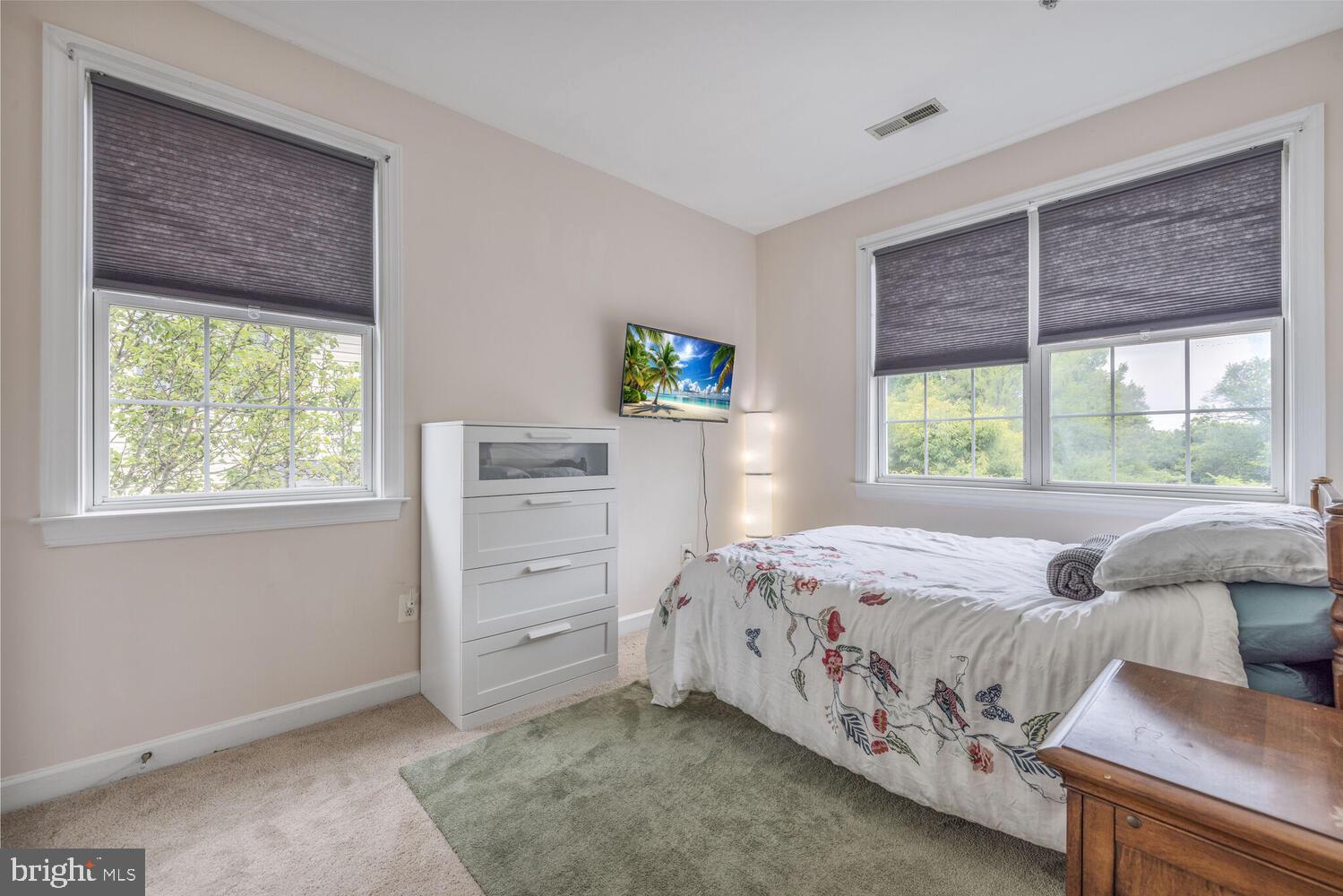 3334 Castle Ridge Circle, Unit 8 Silver Spring, MD 20904 - Photo 20 of 32 a bedroom with a bed and a window
