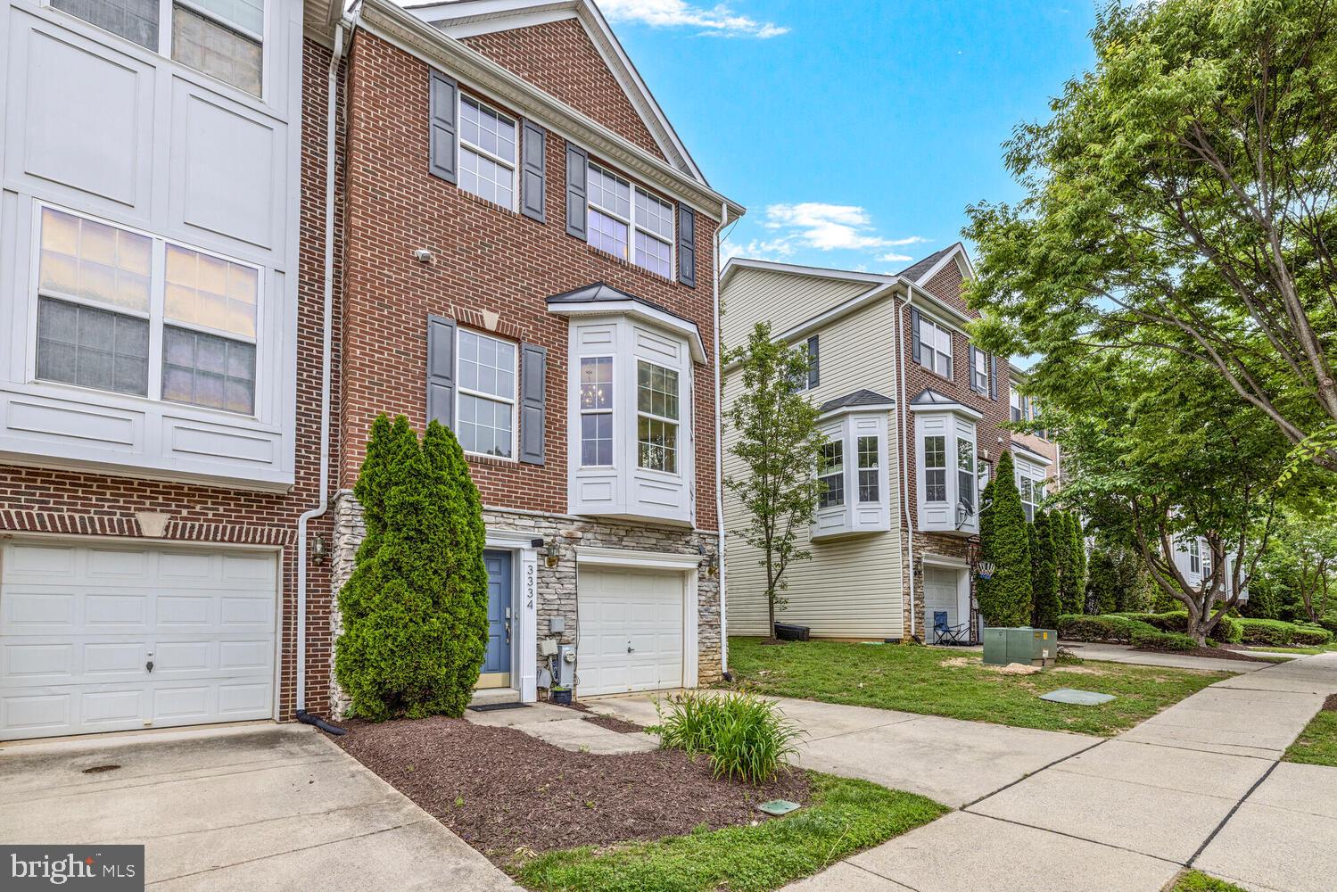 3334 Castle Ridge Circle, Unit 8 Silver Spring, MD 20904 - Photo 28 of 32 a front view of a house with a yard