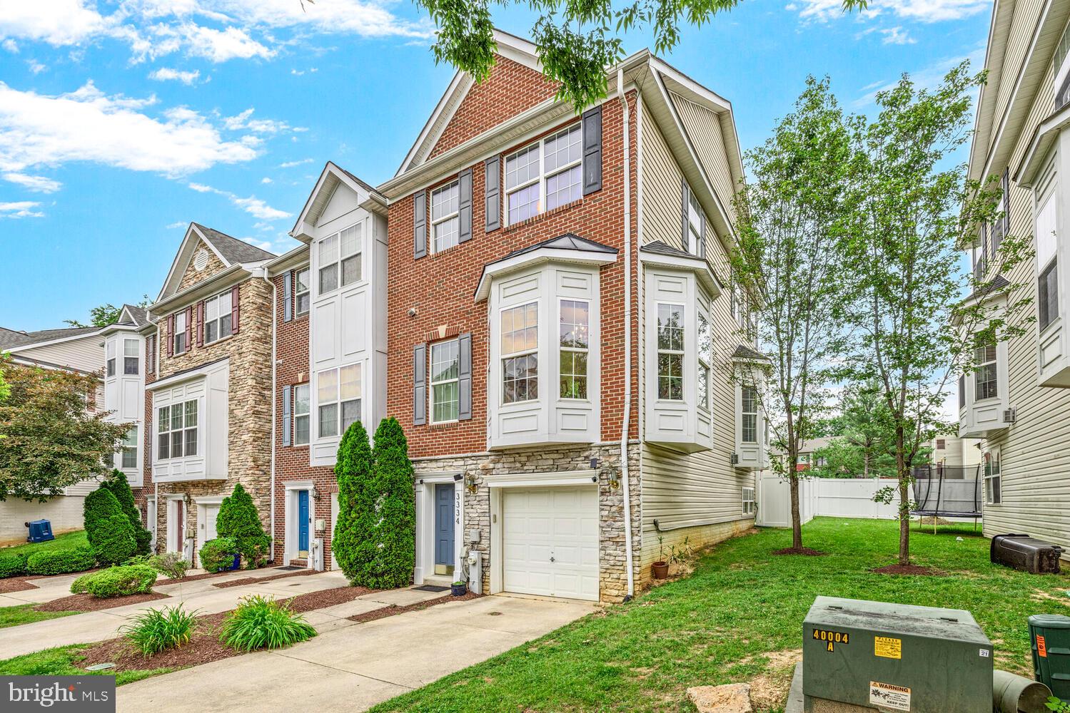 3334 Castle Ridge Circle, Unit 8 Silver Spring, MD 20904 - Photo 29 of 32 front view of a house with a yard