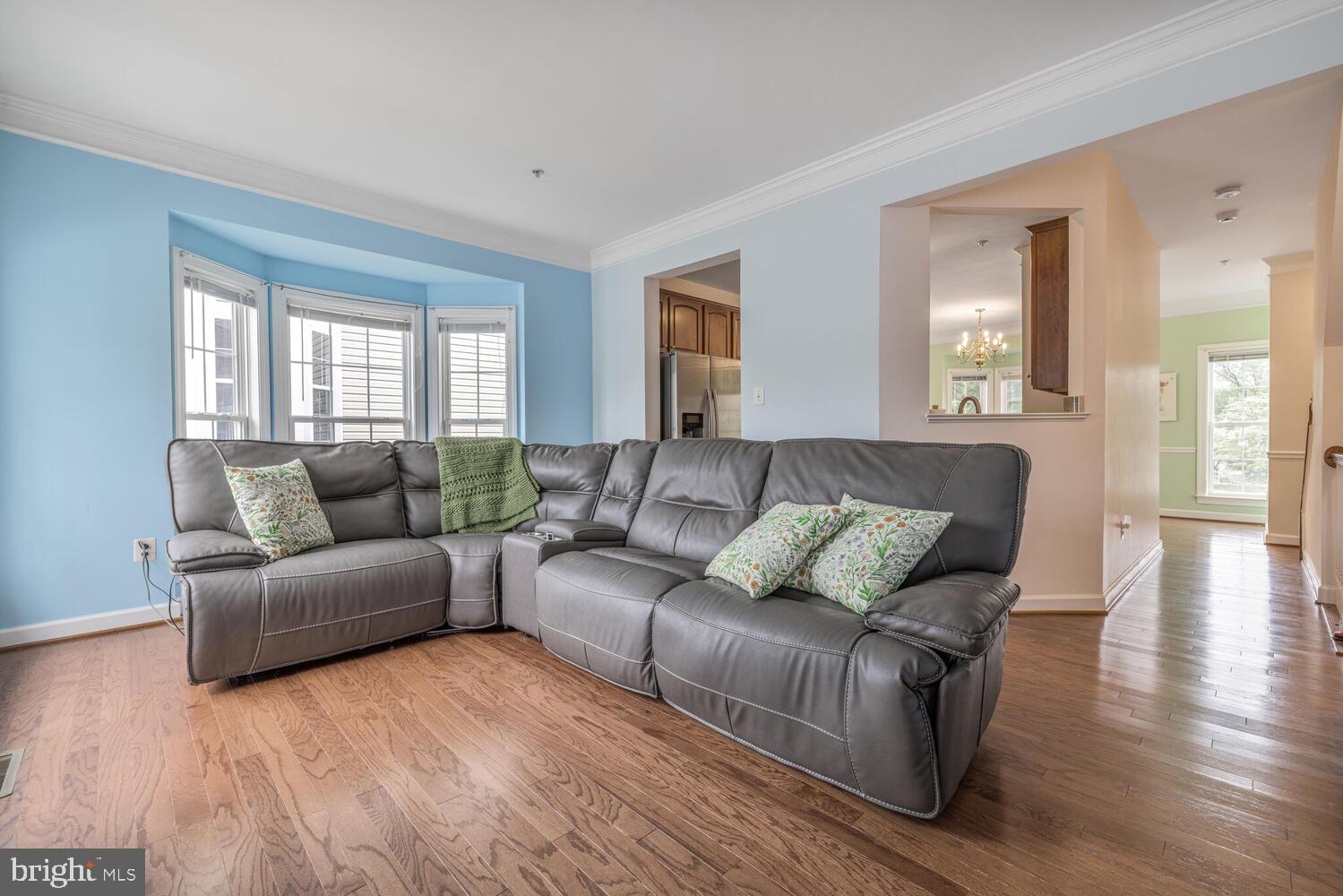 3334 Castle Ridge Circle, Unit 8 Silver Spring, MD 20904 - Photo 7 of 32 a living room with furniture and wooden floor