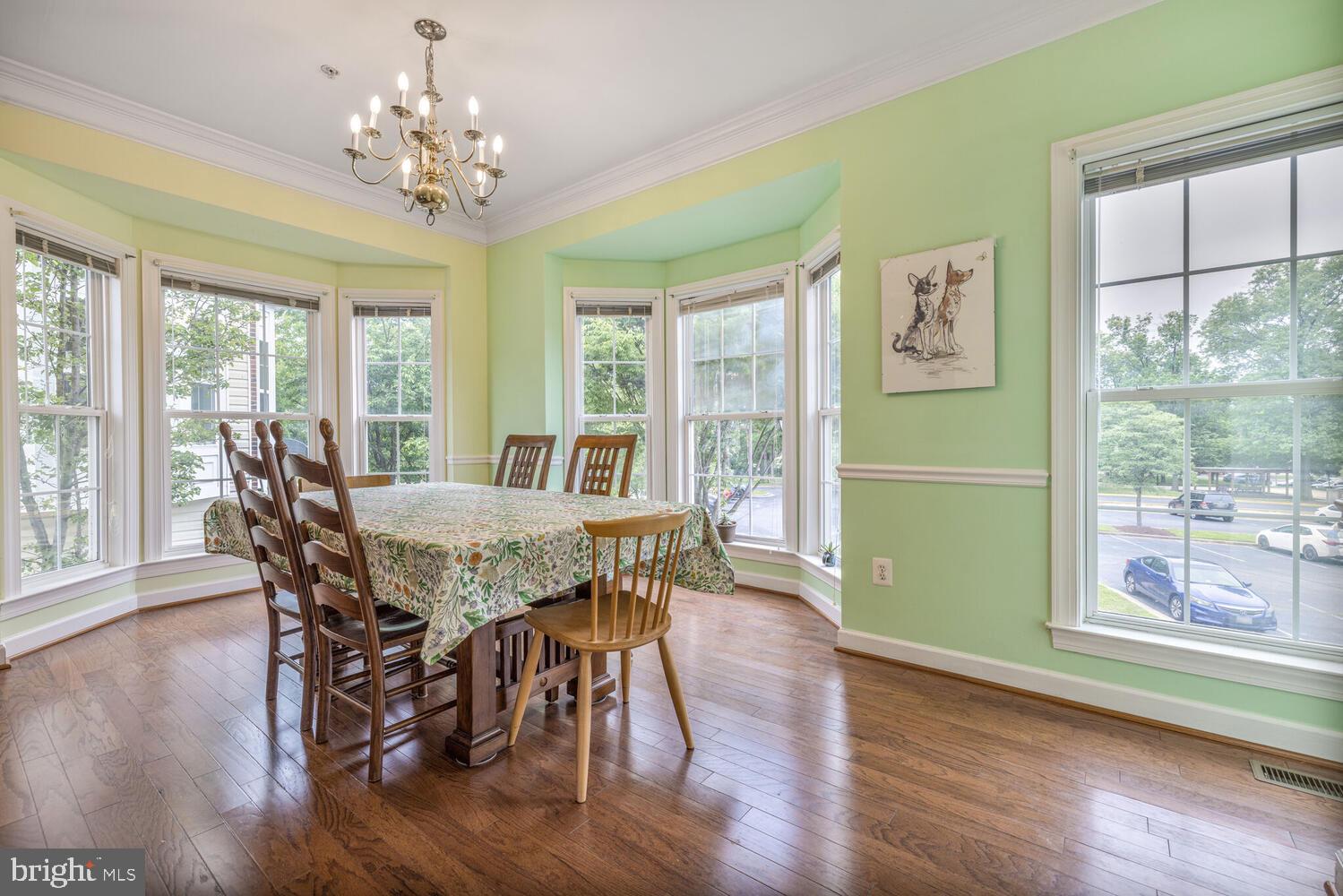3334 Castle Ridge Circle, Unit 8 Silver Spring, MD 20904 - Photo 10 of 32 a view of a dining room with furniture window and wooden floor