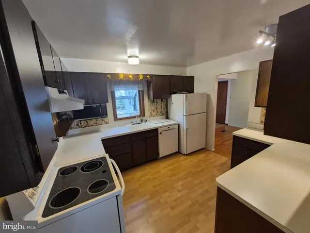 a room with a sink a washer and dryer