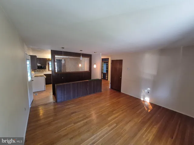 a view of a living room with furniture and a flat screen tv