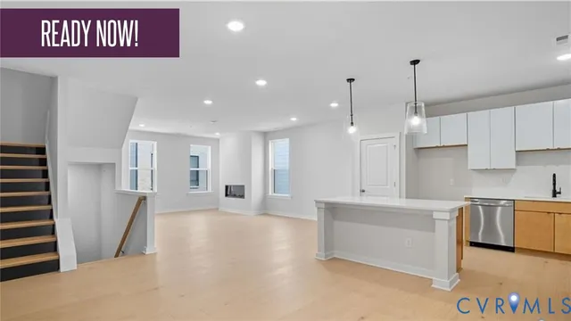 a view of a kitchen with a sink and a microwave