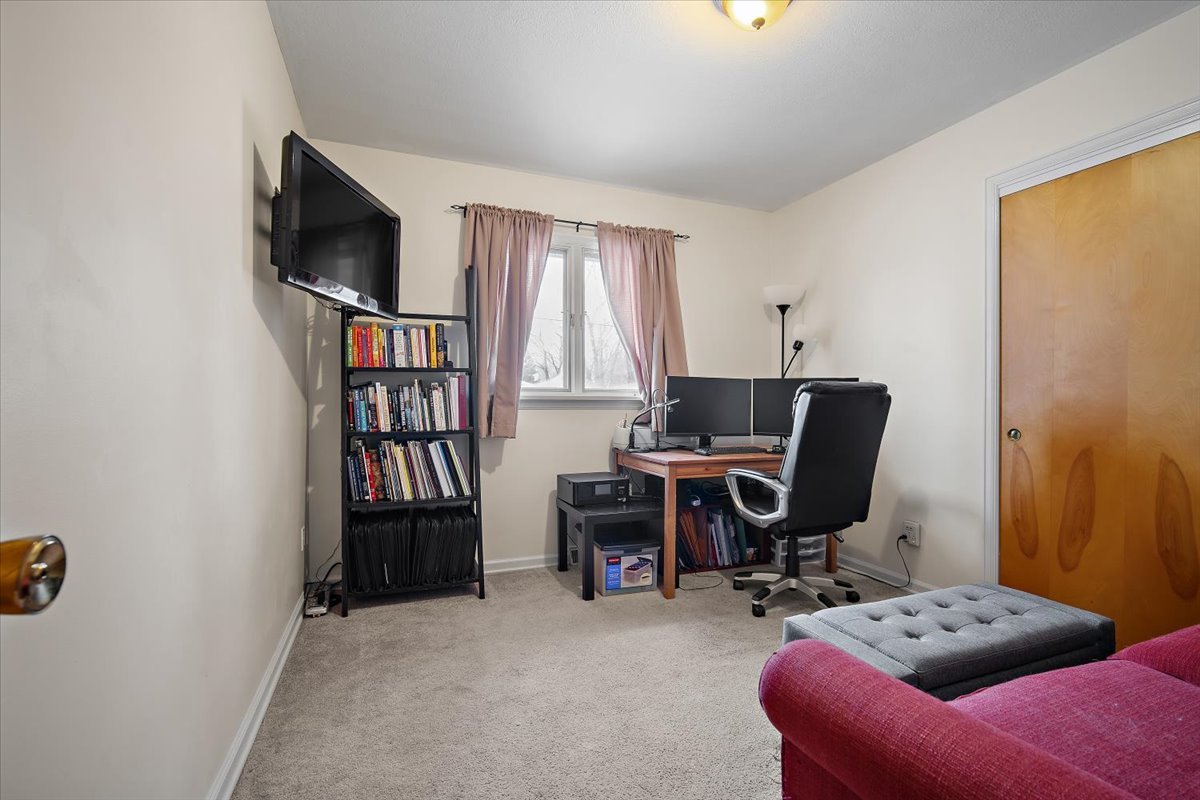 203 South Cottage Avenue Normal, IL 61761 - Photo 16 of 25 a view of a workspace with furniture and a window