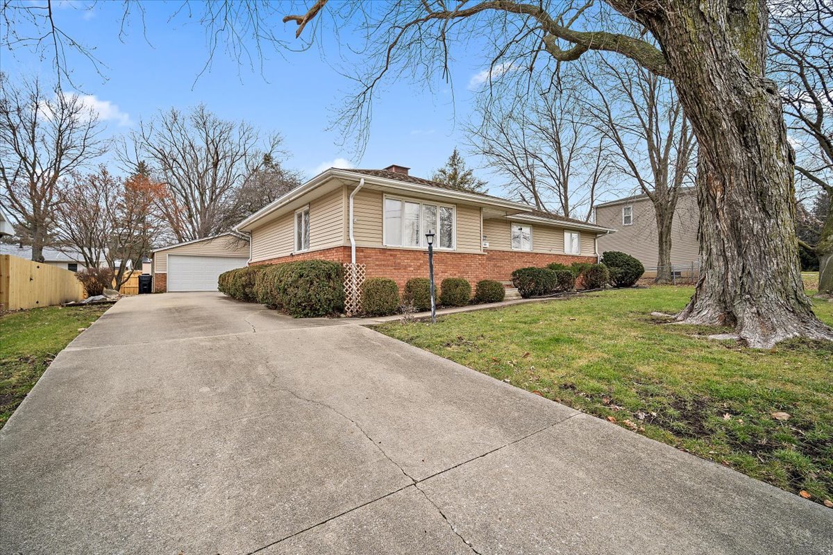203 South Cottage Avenue Normal, IL 61761 - Photo 3 of 25 a front view of a house with a yard