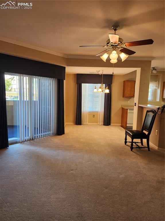 3748 Riviera Grove, Unit 101 Colorado Springs, CO 80922 - Photo 18 of 19 a view of a livingroom with furniture window and wooden floor