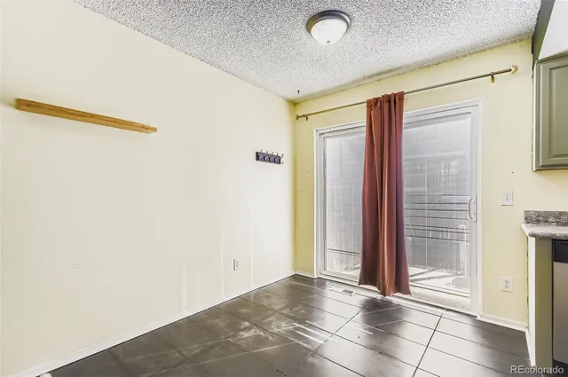 a view of a hallway with a glass door