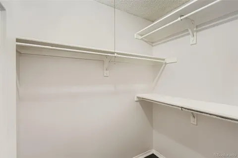 a view of a room with racks on the wall