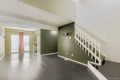 a view of an entryway with wooden floor