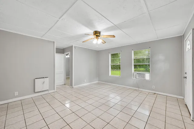 a view of an empty room with a window