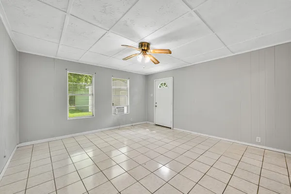 a view of an empty room with a window