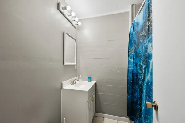 a bathroom with a sink and mirror