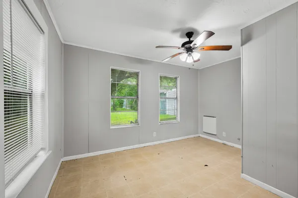 a view of an empty room with a window