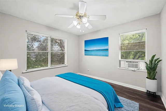 a bedroom with a large bed and a window