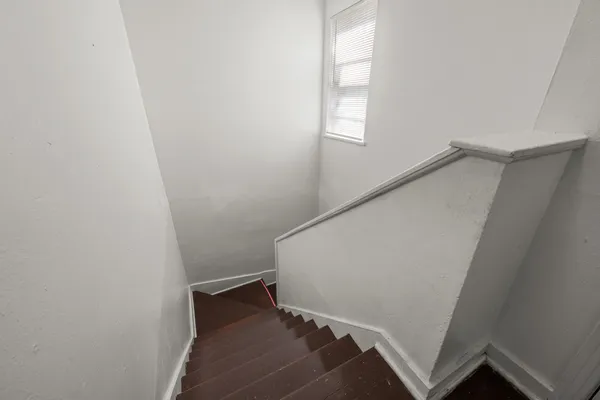 a view of entryway with window and stairs