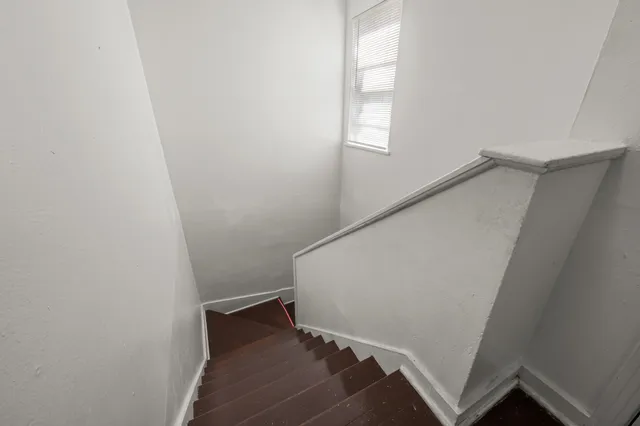 a view of entryway with window and stairs