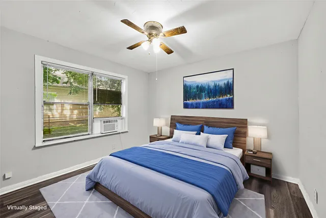 a bedroom with a large bed and a window