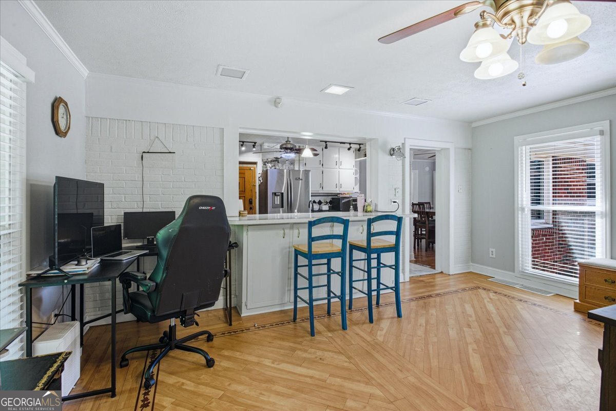3270 Rex Road Rex, GA 30273 - Photo 13 of 35 a view of a dining room with furniture and wooden floor