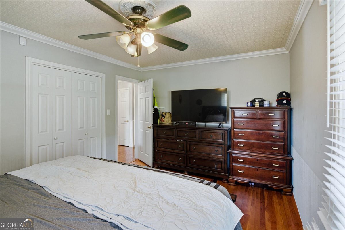 3270 Rex Road Rex, GA 30273 - Photo 22 of 35 a bedroom with a bed and a flat screen tv