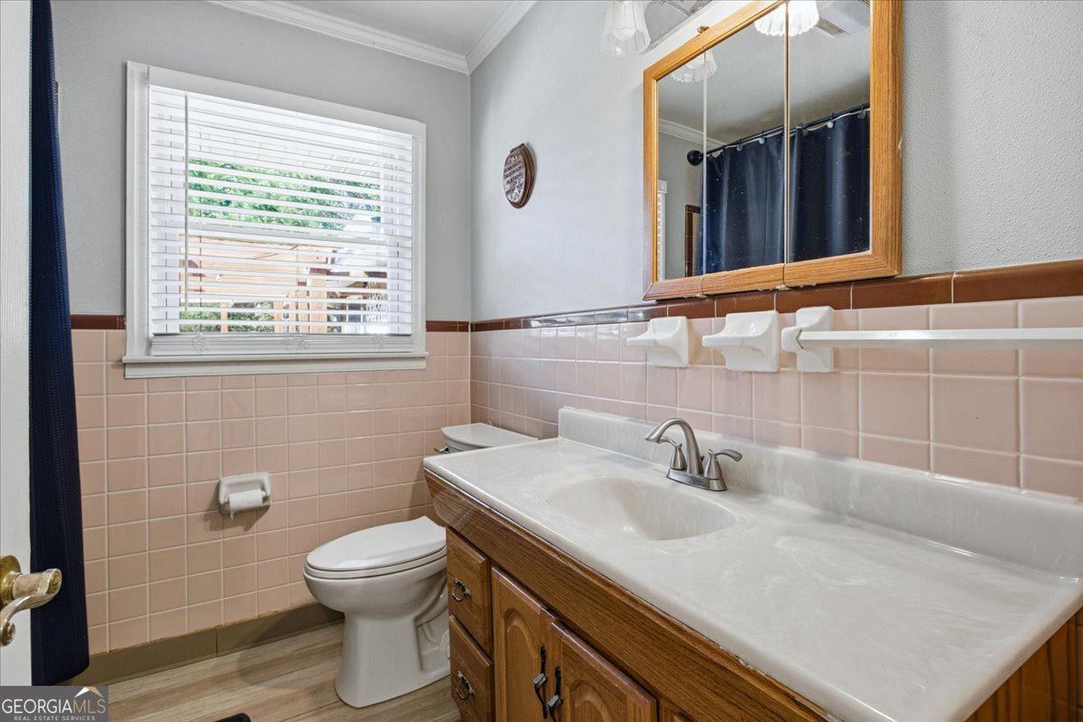 3270 Rex Road Rex, GA 30273 - Photo 23 of 35 a bathroom with a sink toilet and mirror