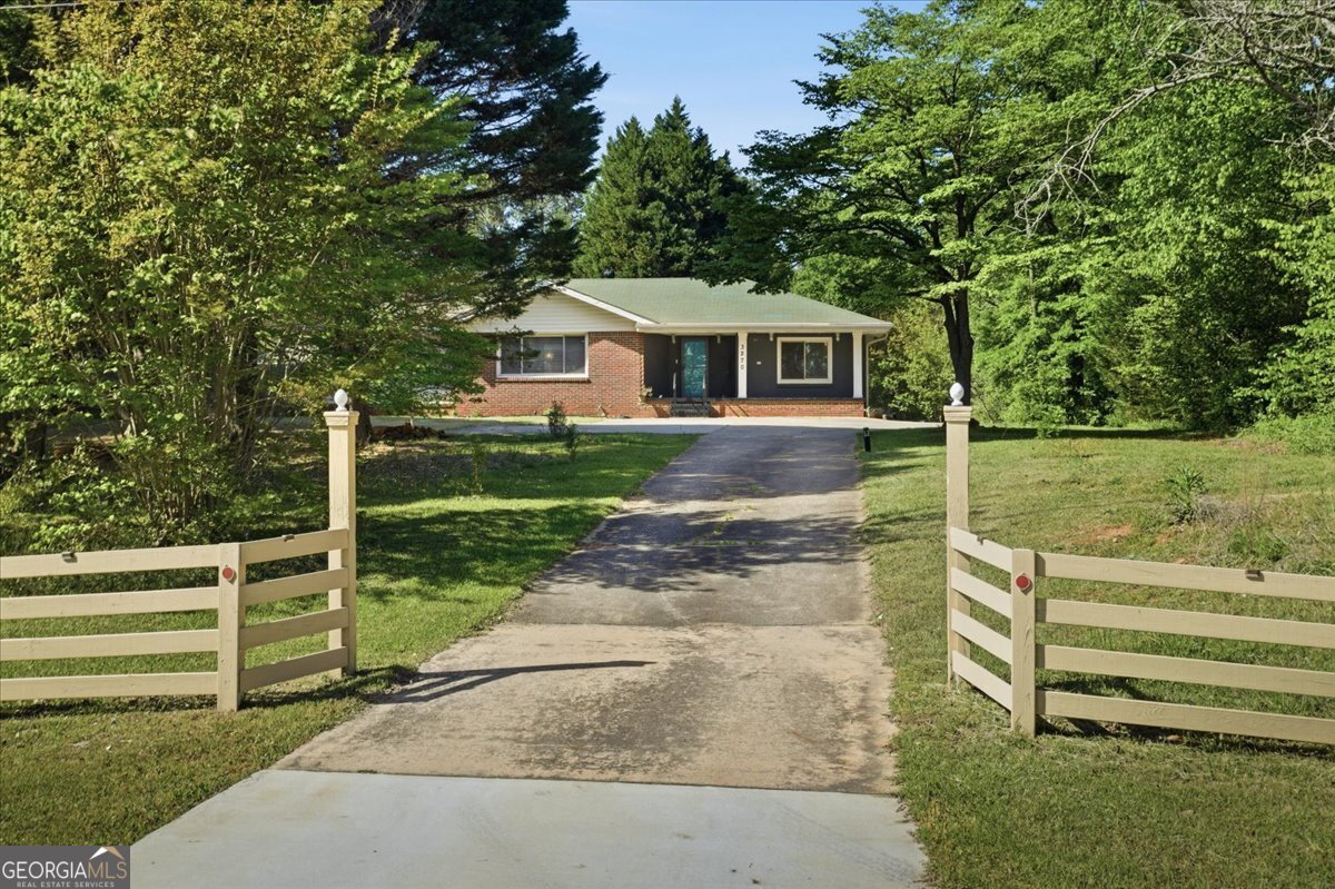 3270 Rex Road Rex, GA 30273 - Photo 25 of 35 a front view of a house with a yard