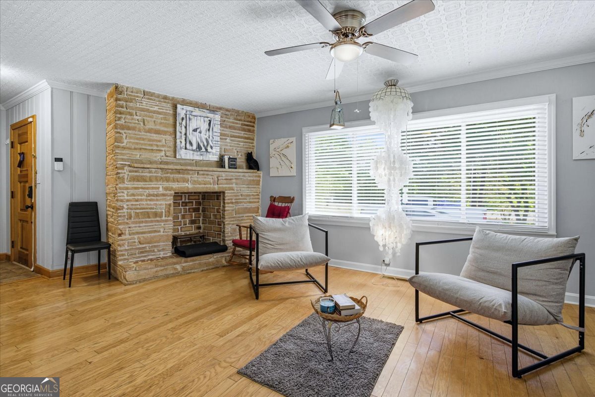 3270 Rex Road Rex, GA 30273 - Photo 5 of 35 a living room with furniture and a fireplace