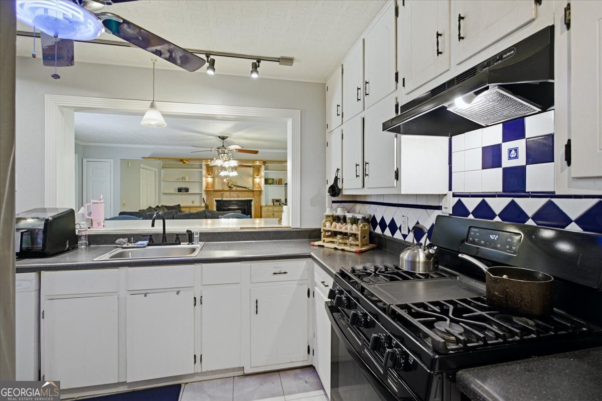 3270 Rex Road Rex, GA 30273 - Photo 8 of 35 a kitchen with a stove and a sink