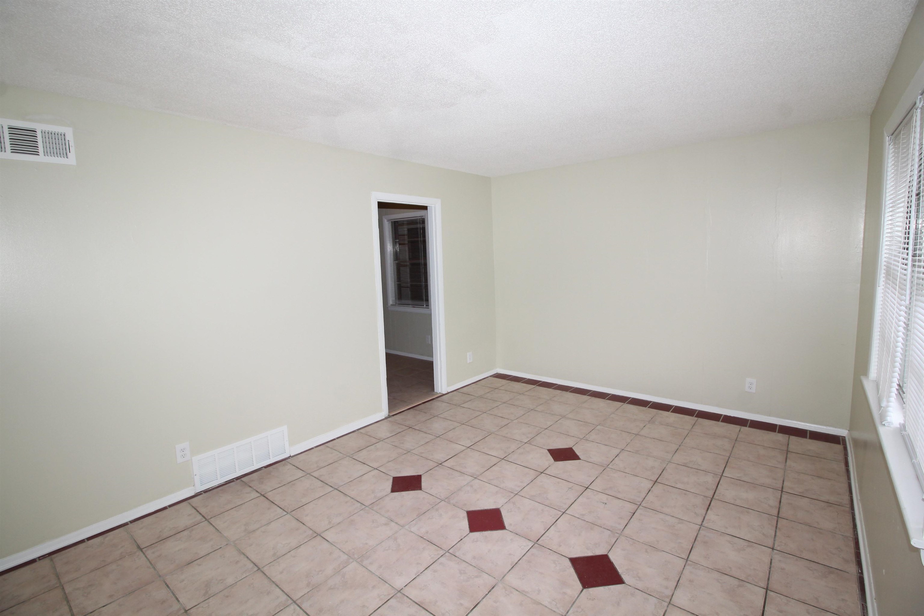 5190 Cottonwood Road Memphis, TN 38118 - Photo 11 of 26 a view of an empty room and window