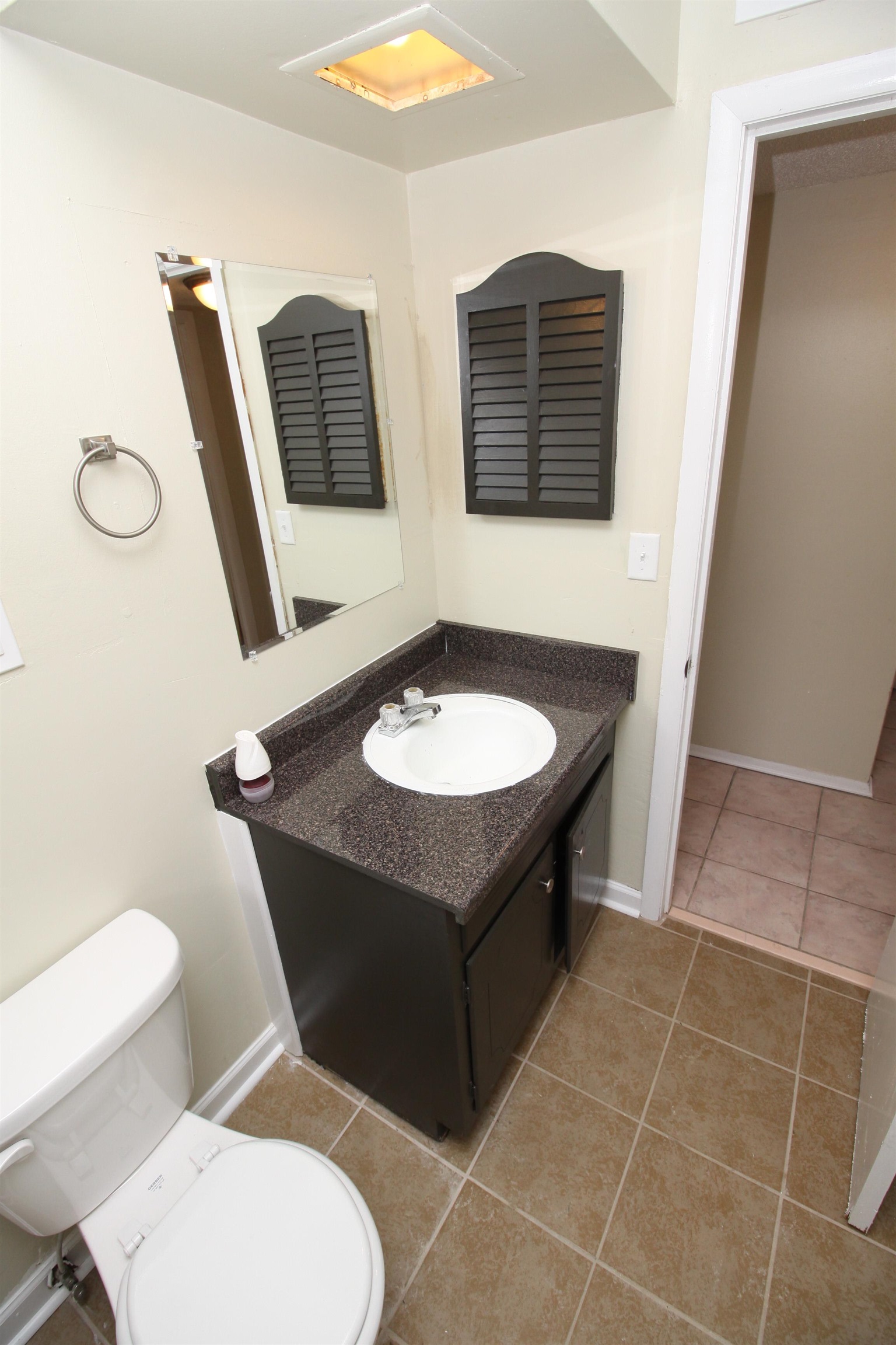 5190 Cottonwood Road Memphis, TN 38118 - Photo 15 of 26 a bathroom with a toilet sink and mirror