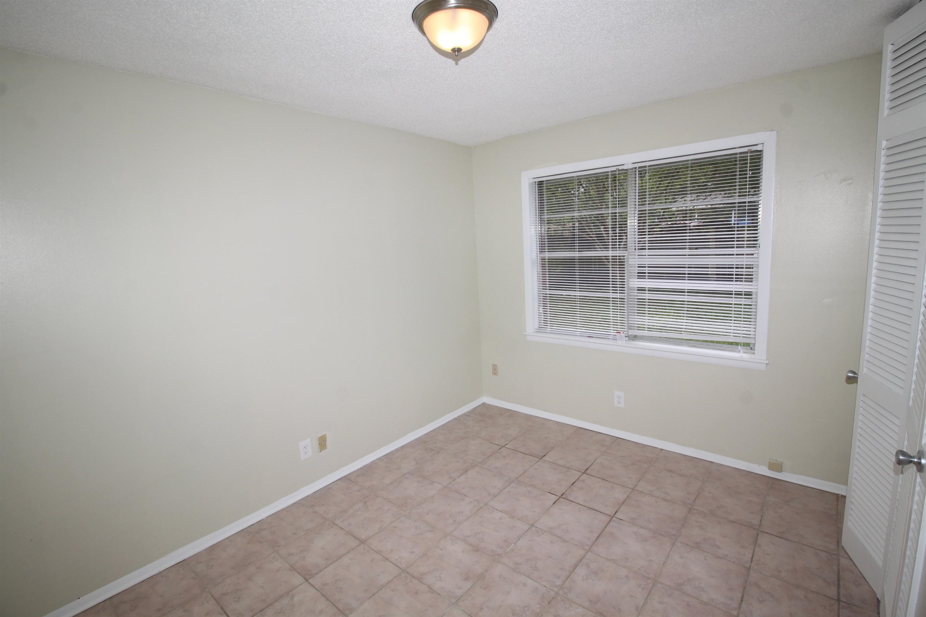 5190 Cottonwood Road Memphis, TN 38118 - Photo 16 of 26 a view of an empty room with a window