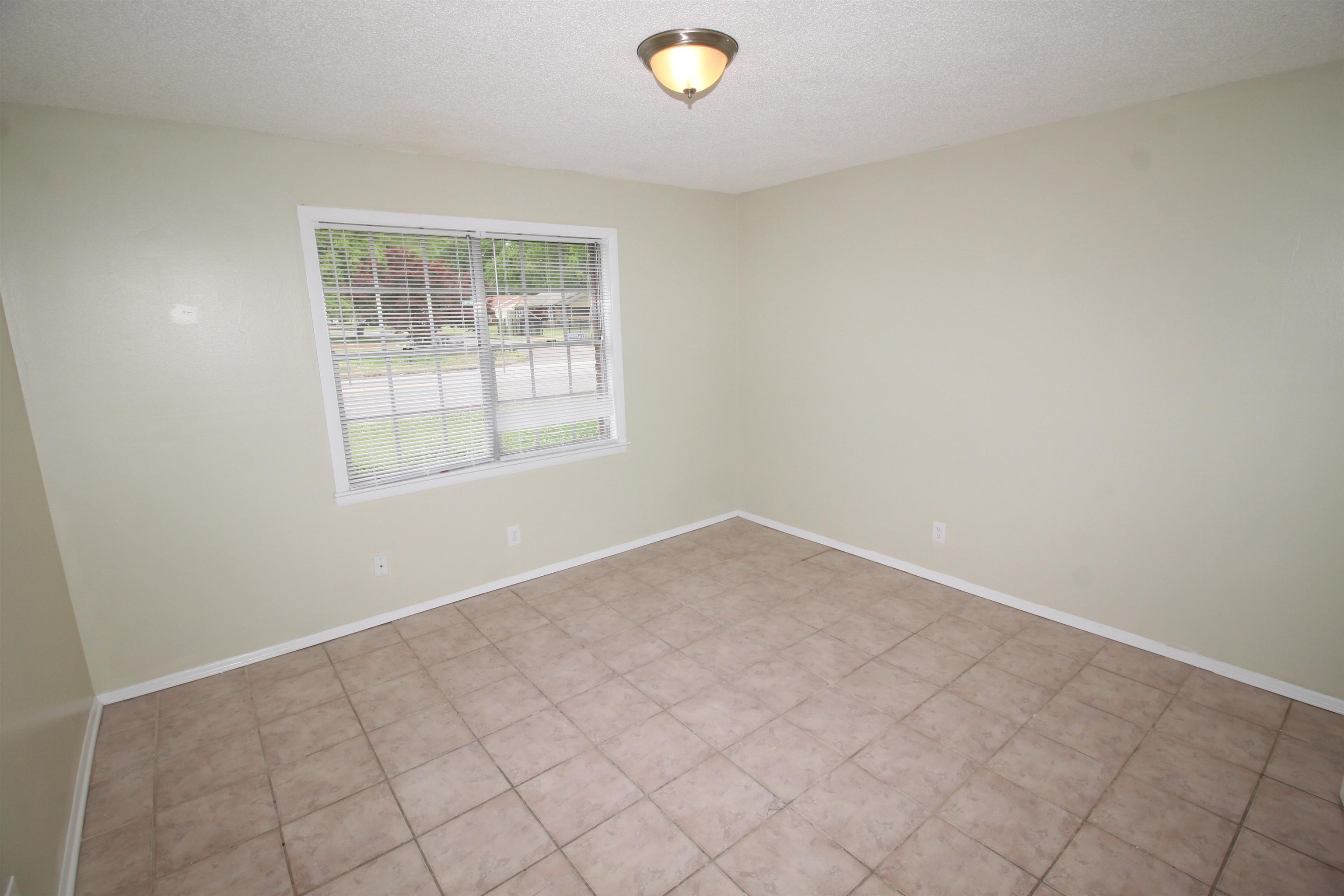 5190 Cottonwood Road Memphis, TN 38118 - Photo 18 of 26 an empty room with windows