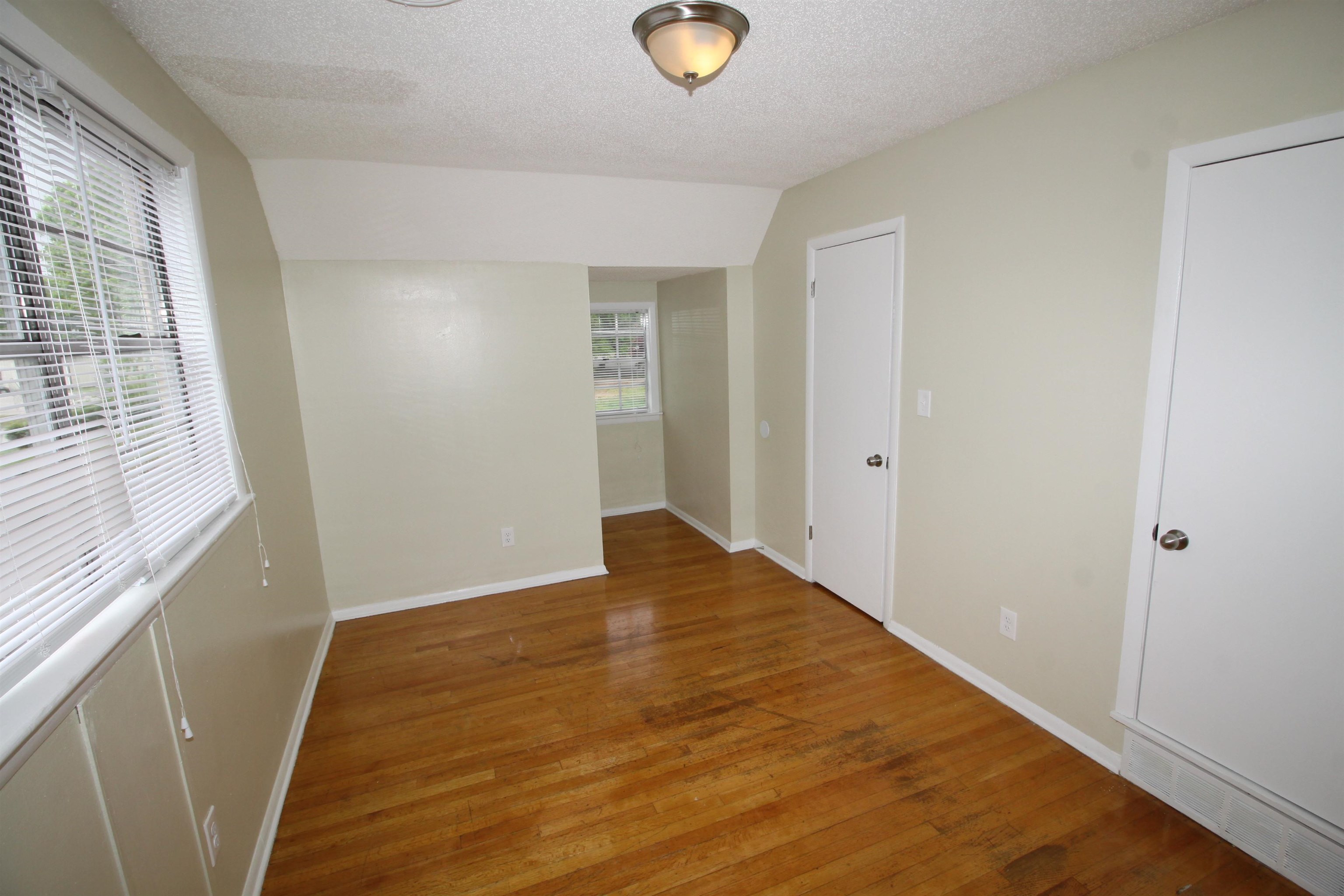 5190 Cottonwood Road Memphis, TN 38118 - Photo 26 of 26 a view of empty room with wooden floor and fan