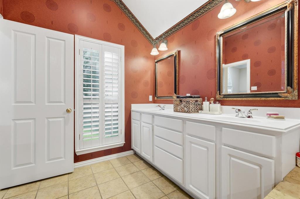 2012 Hayden Lane Corinth, TX 76210 - Photo 28 of 40 a bathroom with a sink and a mirror