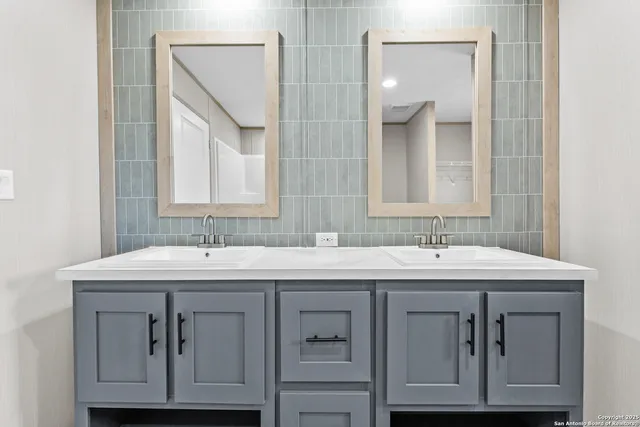 a bathroom with a sink and a mirror