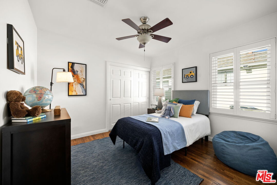 3770 Buckingham Road Los Angeles, CA 90016 - Photo 11 of 19 a bedroom with a bed and a window