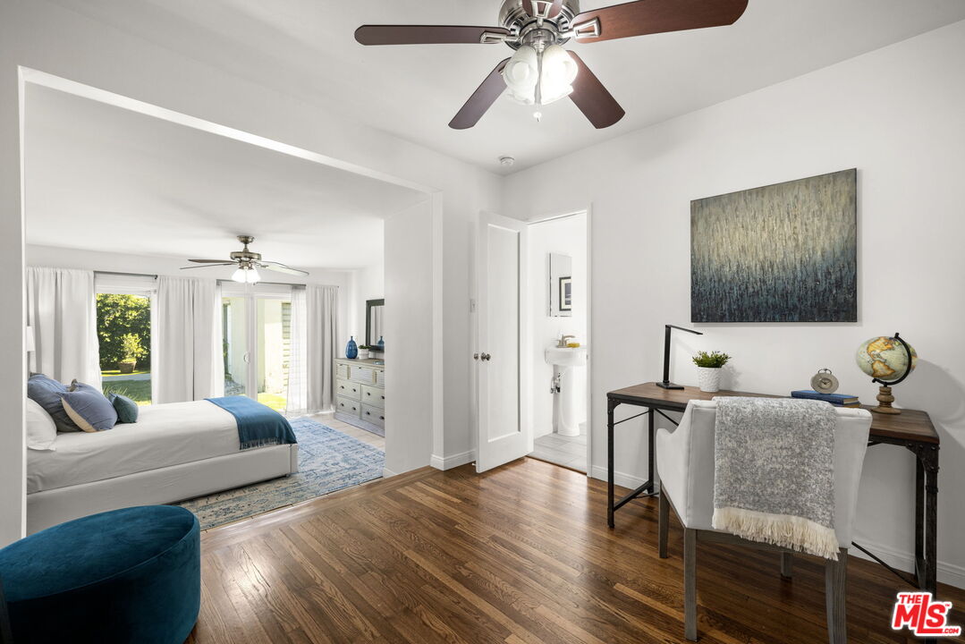 3770 Buckingham Road Los Angeles, CA 90016 - Photo 14 of 19 a living room with furniture and wooden floor