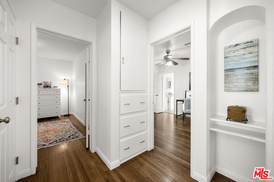 3770 Buckingham Road Los Angeles, CA 90016 - Photo 10 of 19 a view of a hallway with wooden floor and closet