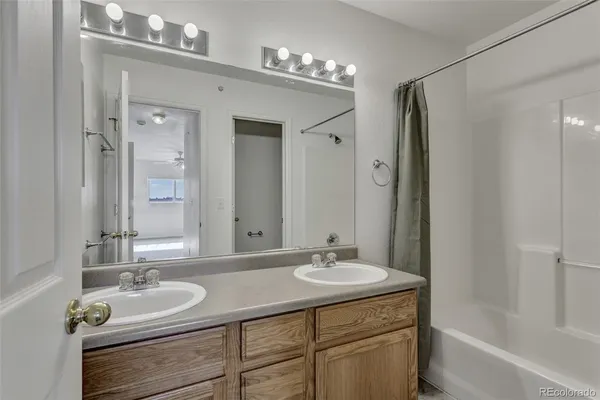a bathroom with a sink double vanity and a mirror