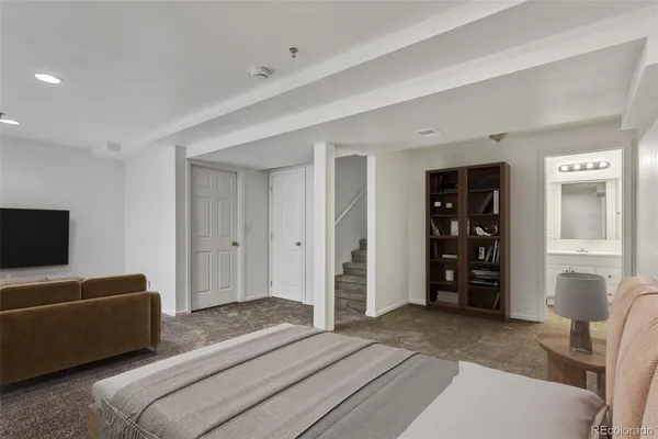 a bedroom with a bed and furniture