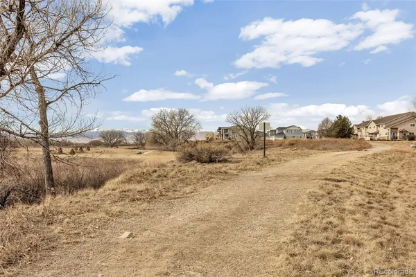 a view of dirt yard and covered with snow