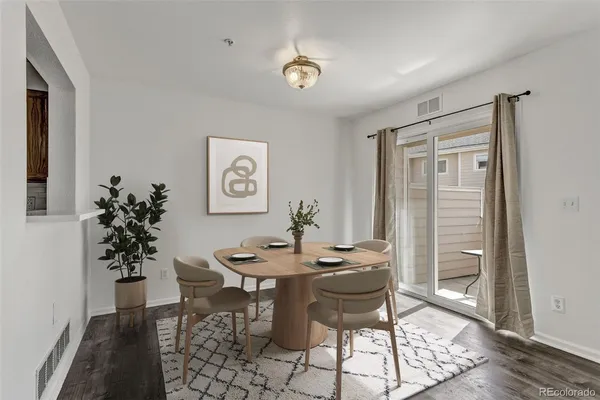 a dining room with furniture and window