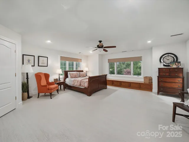 a bedroom with furniture and a window