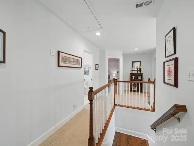 a view of a hallway with seating area