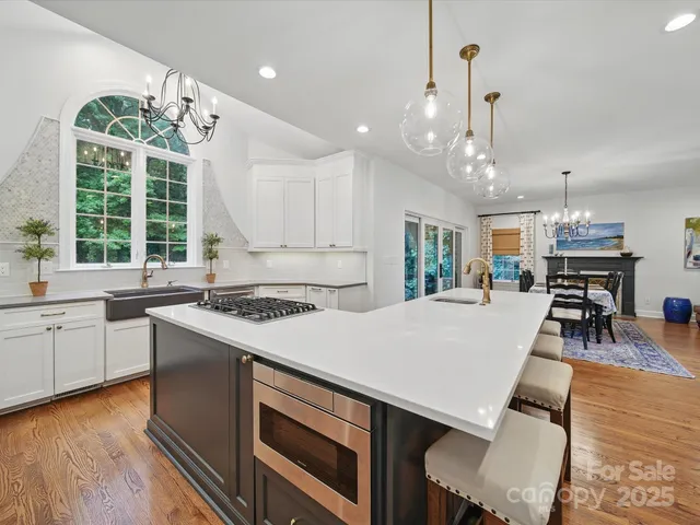 an open kitchen with a table and chairs in it